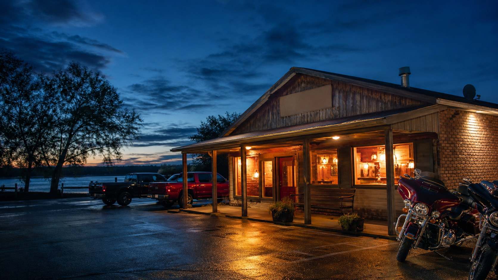 A warm river-road bar and grill exterior at dusk near the Mississippi River